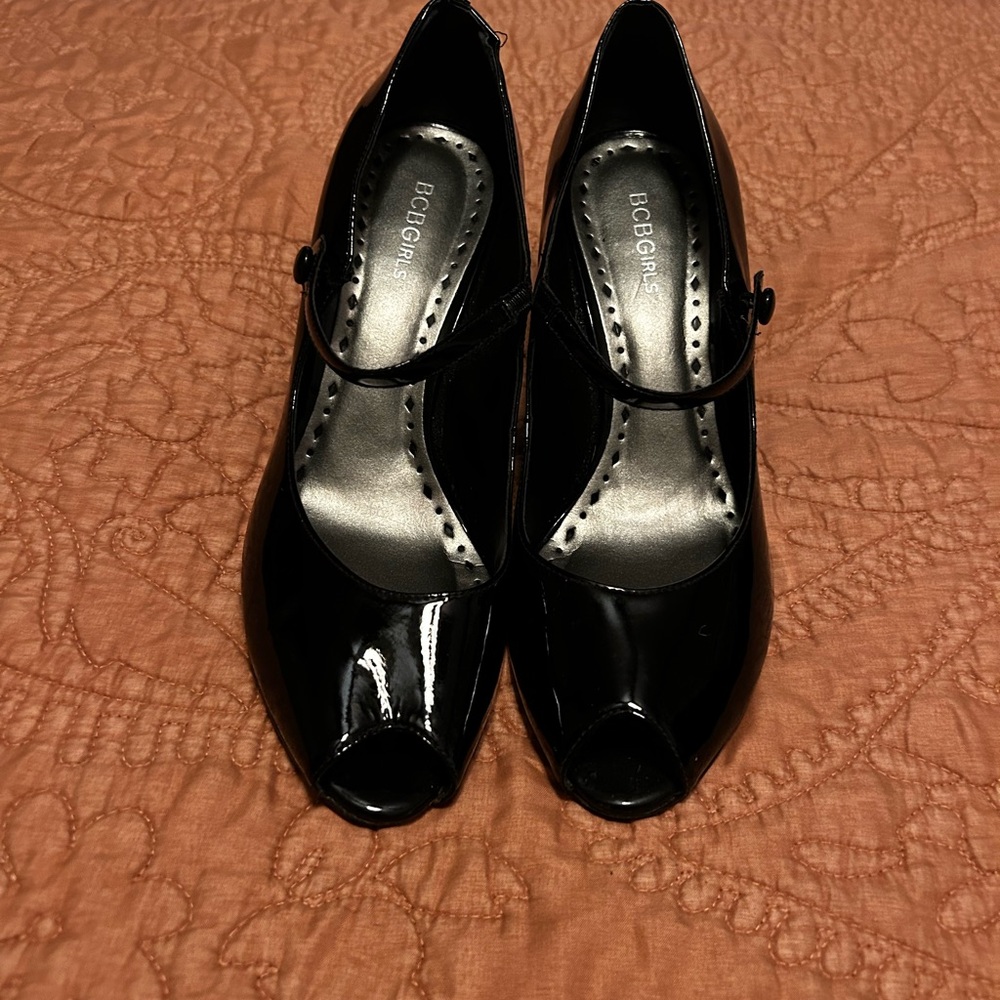 BCBGeneration Black Heels with Classic Strap Design